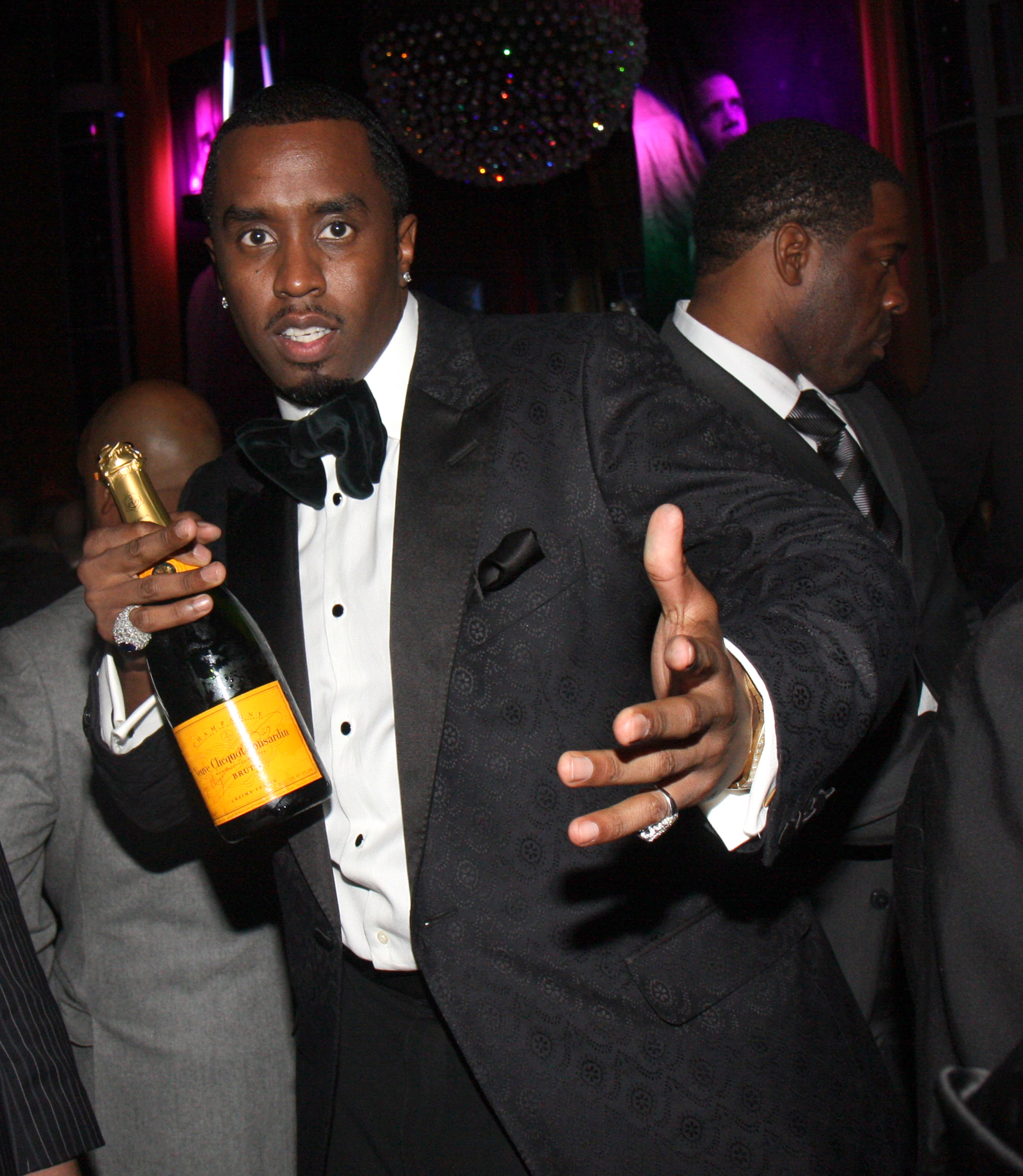 Sean Combs holding a bottle of champagne in 2008.