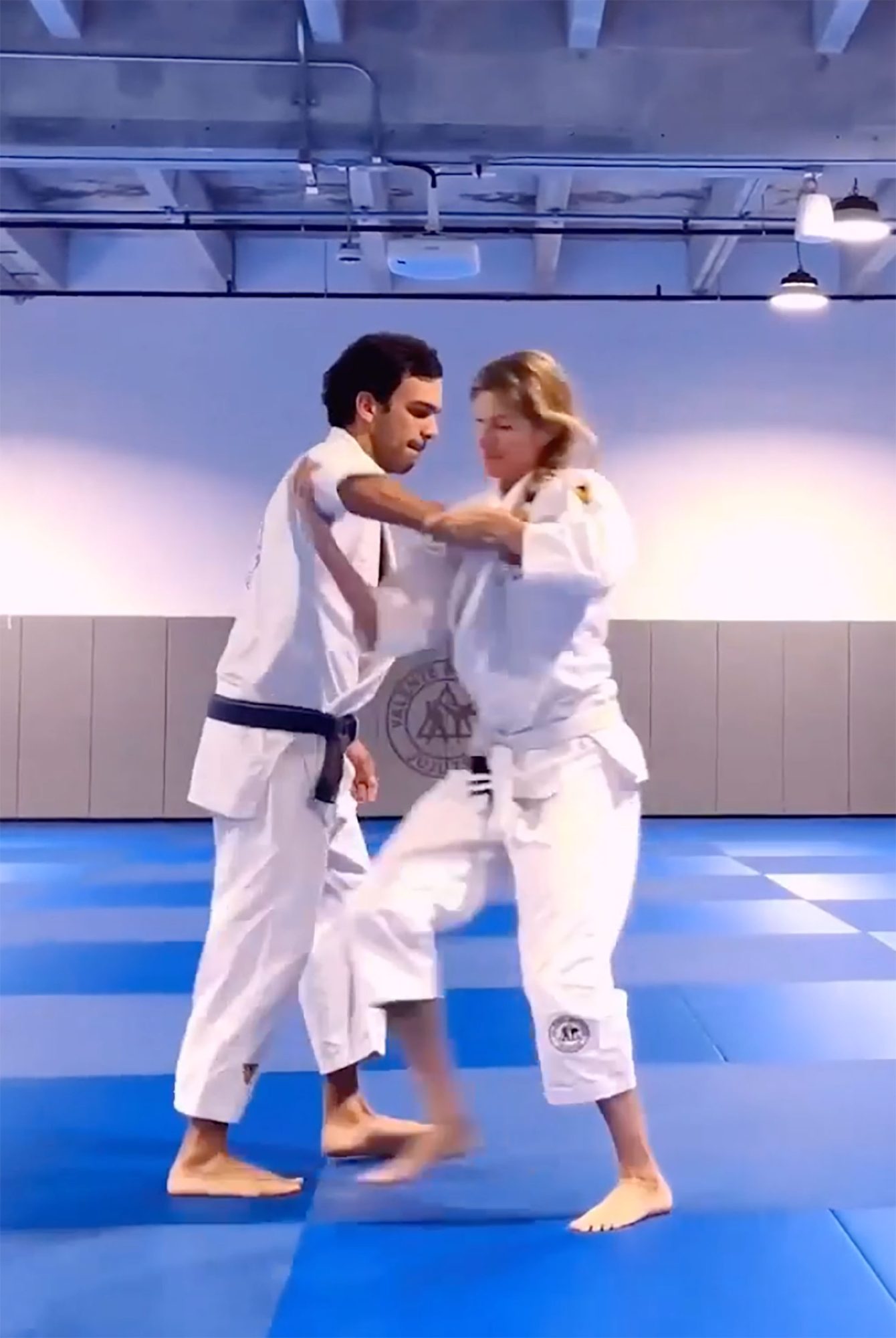 Gisele Bündchen and Joaquim Valente doing ju jitsu.