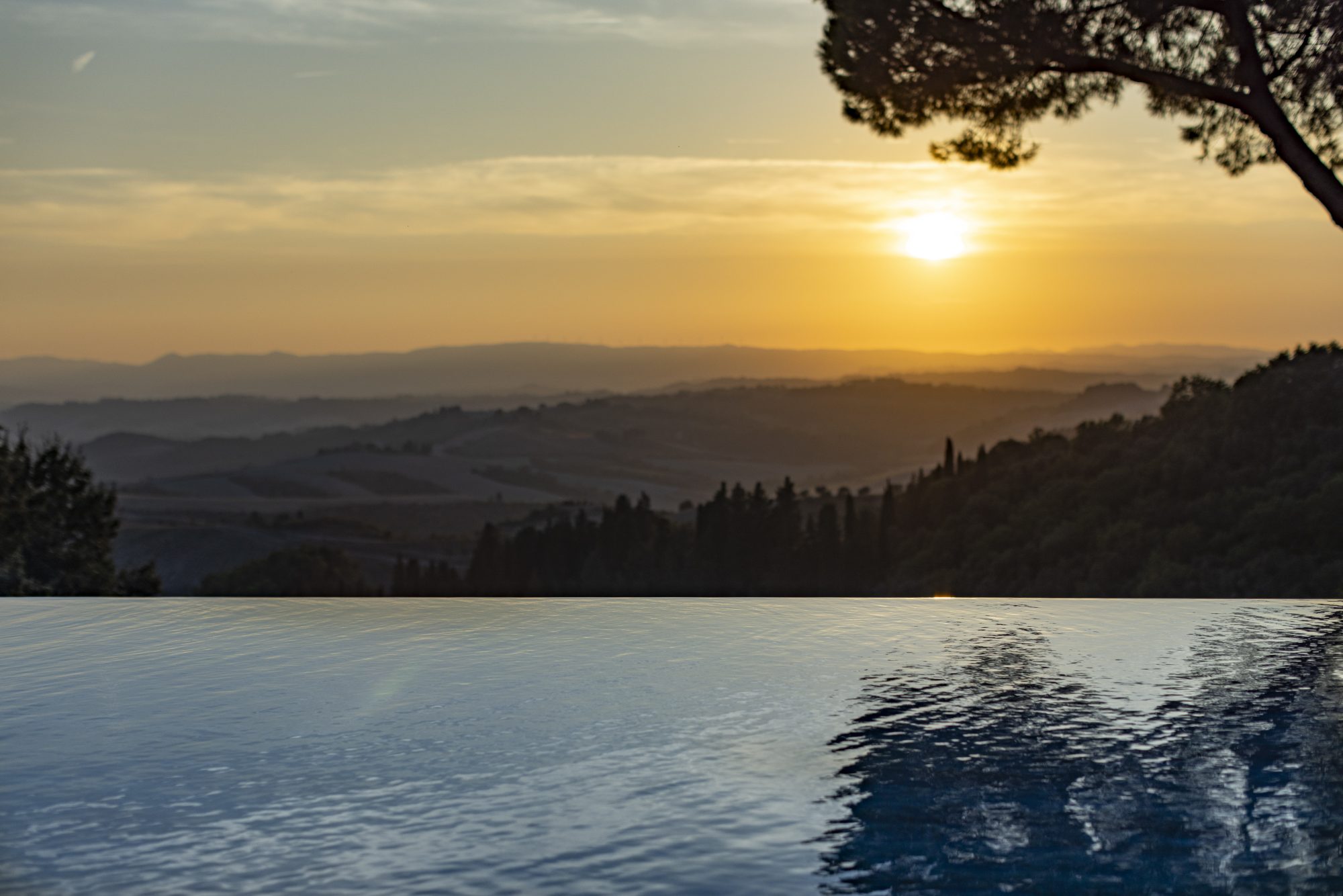 Rakxa Wellness Castelfalfi's swimming pool overlooking Tuscany.