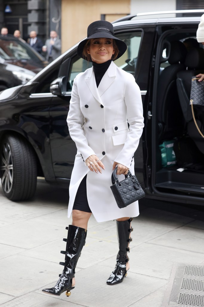 Jennifer Lopez steps out in London in a large hat and stylish boots.