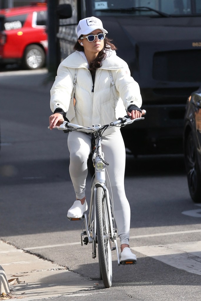 Michelle Rodriguez wears all white while out for a bike ride in Los Angeles.