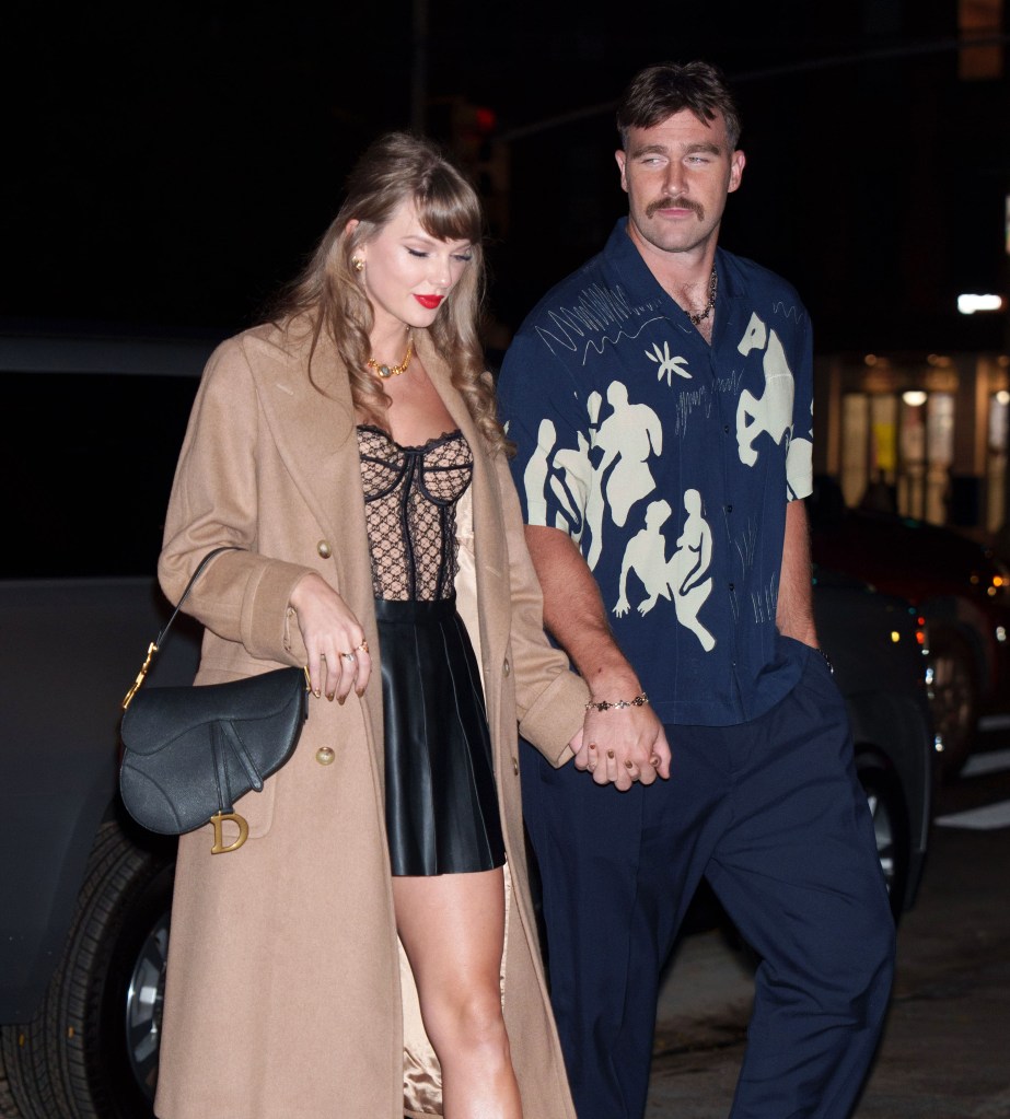 Taylor Swift and Travis Kelce are seen holding hands on October 11, 2024 in New York City. 