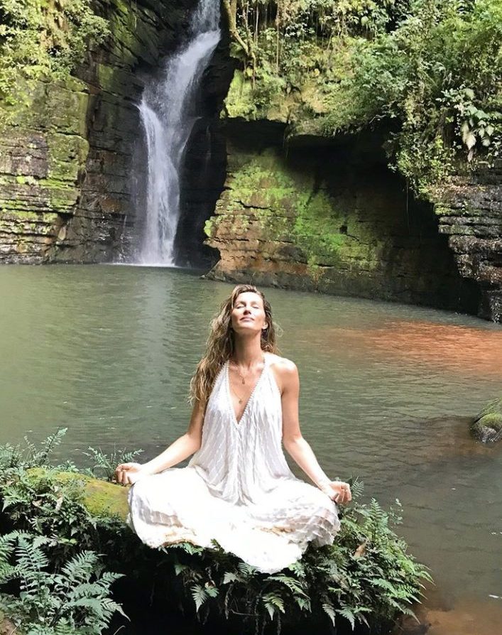 Gisele Bundchen meditates.