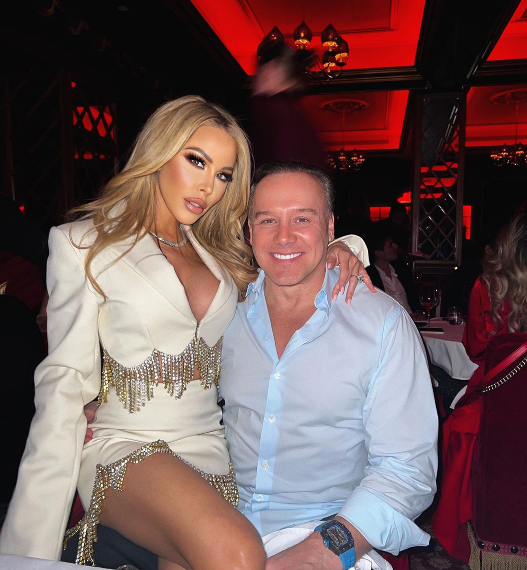 Lisa Hochstein sitting on Lenny Hochstein's lap