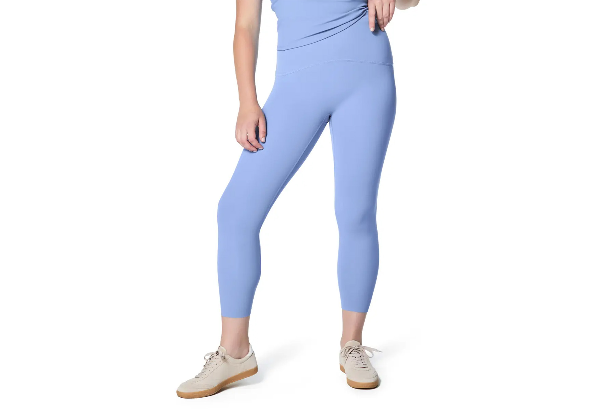 A model in pale blue leggings