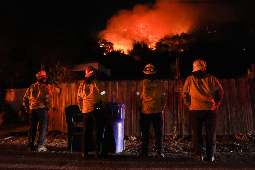 Firefighters putting out the Palisades Fire