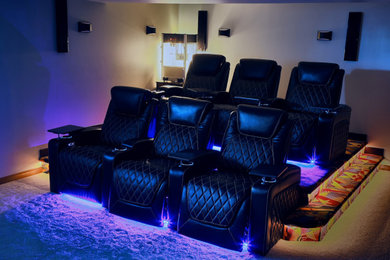 Mid-sized transitional open concept carpeted and multicolored floor home theater photo in Edmonton with a wall-mounted tv