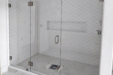 Inspiration for a mid-sized coastal master alcove shower remodel in Boston with a hinged shower door