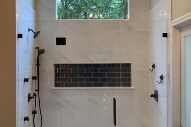 Inspiration for a mid-sized mid-century modern master white tile and marble tile dark wood floor, brown floor and vaulted ceiling bathroom remodel in Atlanta with beige walls and a hinged shower door