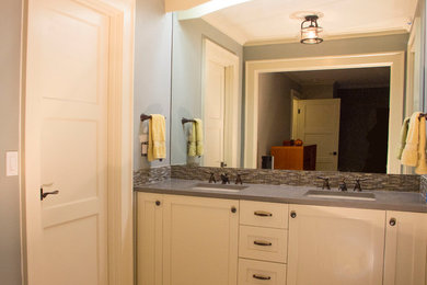 Mid-sized transitional 3/4 bathroom photo in Seattle with shaker cabinets, white cabinets, gray walls, an undermount sink and solid surface countertops