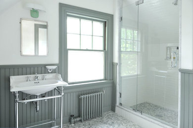This is an example of a medium sized traditional shower room bathroom in Providence with green cabinets, green walls, a console sink, recessed-panel cabinets, an alcove shower, a two-piece toilet, green tiles and marble flooring.
