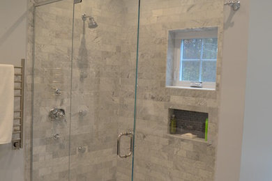 Inspiration for a mid-sized contemporary master gray tile and subway tile marble floor double shower remodel in Boston with an undermount sink, recessed-panel cabinets, black cabinets, marble countertops and a two-piece toilet