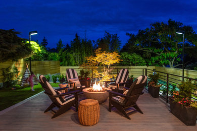 Deck - mid-sized modern backyard deck idea in Seattle with a fire pit and no cover