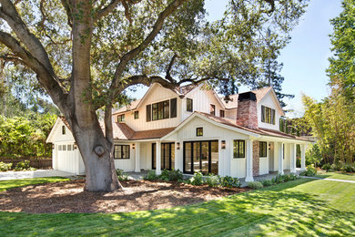 Example of a cottage white two-story wood exterior home design in San Francisco