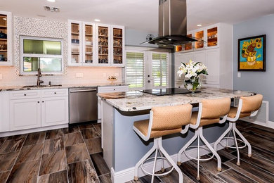 Inspiration for a large timeless l-shaped open concept kitchen remodel in Miami with a double-bowl sink, white cabinets, granite countertops, stainless steel appliances, an island, raised-panel cabinets, white backsplash and subway tile backsplash