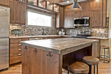 Inspiration for a mid-sized rustic l-shaped medium tone wood floor kitchen remodel in Atlanta with shaker cabinets, dark wood cabinets, wood countertops, multicolored backsplash, stainless steel appliances and an island