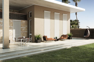 Example of a large trendy backyard tile patio design in San Diego with a roof extension