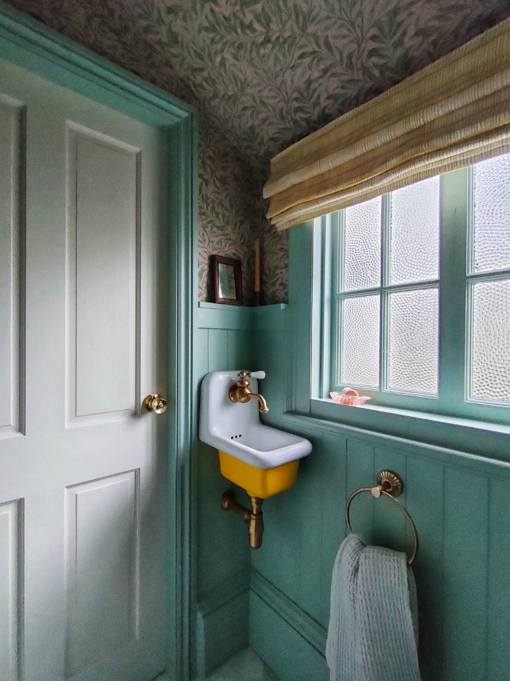 This is an example of a large classic cloakroom in Other with freestanding cabinets, yellow cabinets, a one-piece toilet, marble flooring, a wall-mounted sink and a floating vanity unit.