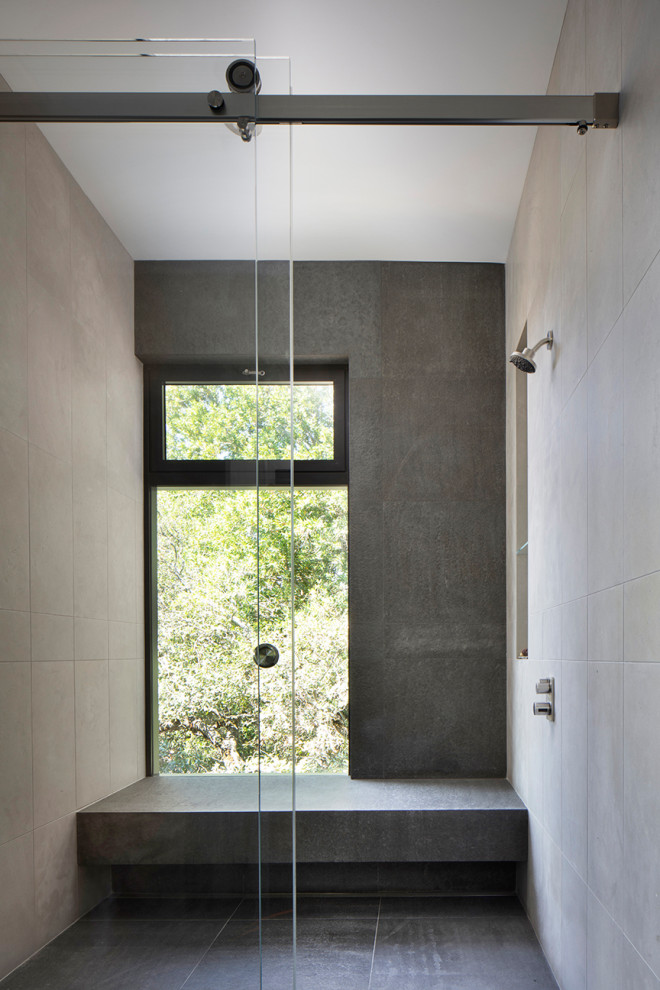 Bathroom - mid-sized modern master gray tile and porcelain tile dark wood floor, gray floor and single-sink bathroom idea in San Francisco with flat-panel cabinets, medium tone wood cabinets, gray walls, granite countertops, gray countertops, a niche and a floating vanity