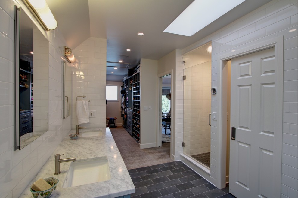 Large transitional master white tile and subway tile concrete floor and gray floor bathroom photo in Denver with flat-panel cabinets, blue cabinets, white walls, an undermount sink, marble countertops, a hinged shower door and gray countertops