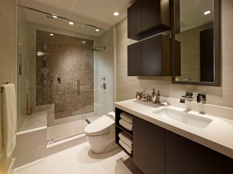 Alcove shower - contemporary beige tile alcove shower idea in Miami with flat-panel cabinets and dark wood cabinets