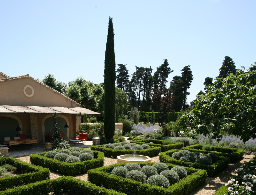 Photo of a large mediterranean formal garden in Other.