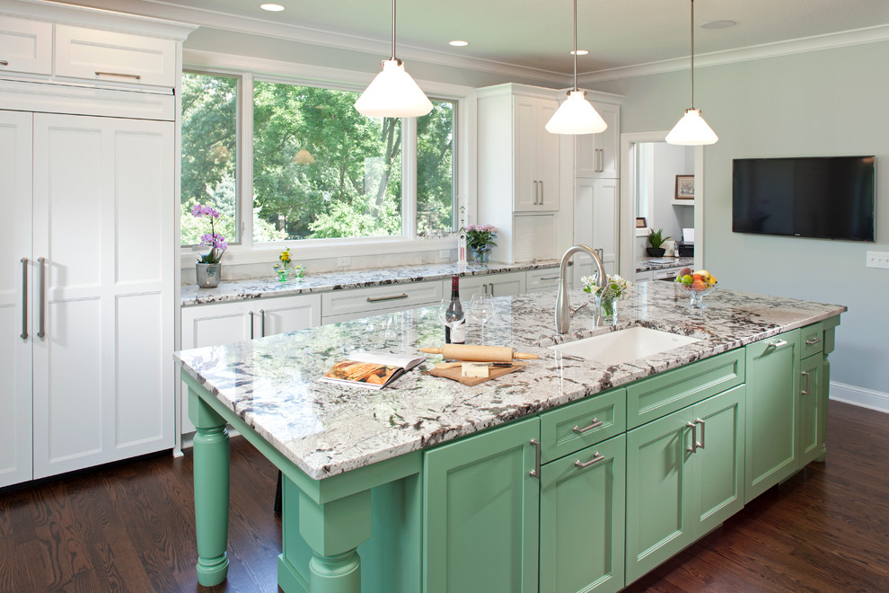 Huge elegant galley dark wood floor eat-in kitchen photo in Minneapolis with an undermount sink, recessed-panel cabinets, green cabinets, paneled appliances, granite countertops, multicolored backsplash, subway tile backsplash and an island