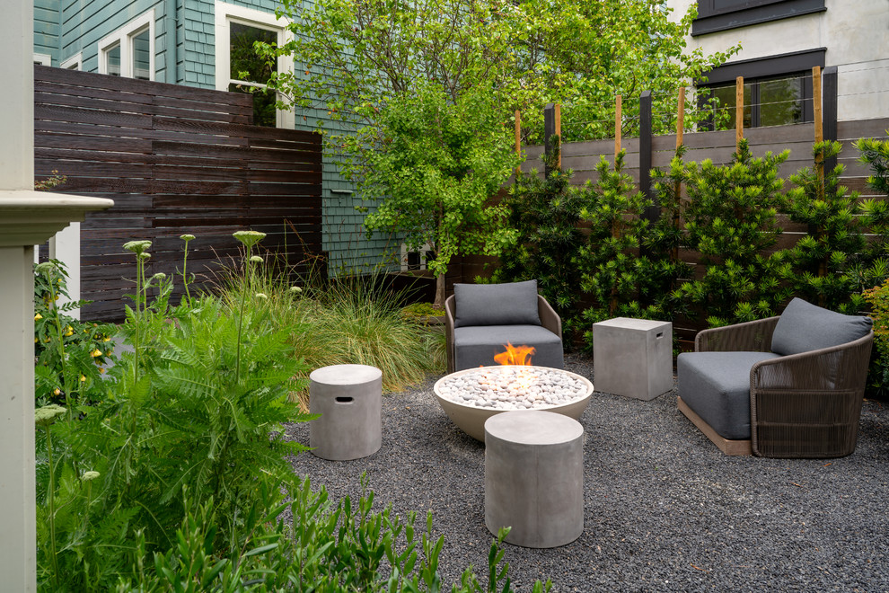 Design ideas for a small contemporary drought-tolerant and partial sun backyard gravel landscaping in San Francisco with a fire pit.