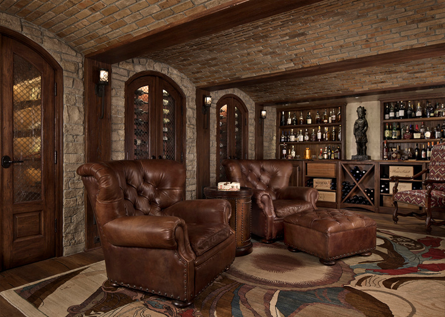 Inspiration for a large timeless dark wood floor and brown floor wine cellar remodel in Detroit with display racks