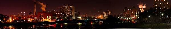 Cambridge over the Charles River at night