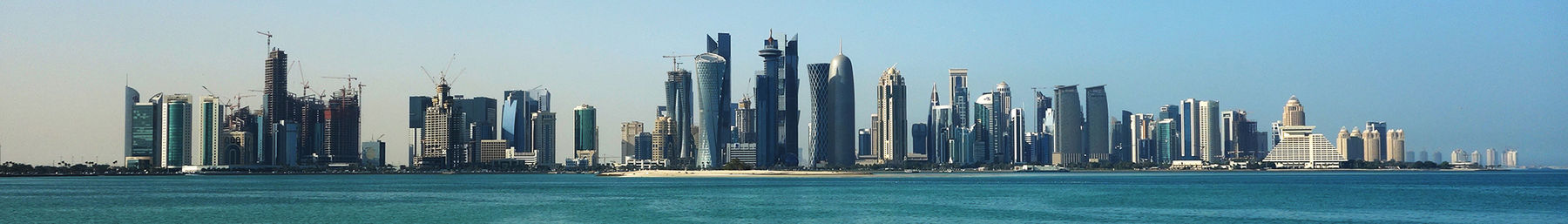 The Doha city skyline, featuring post-modern structures along the Corniche.