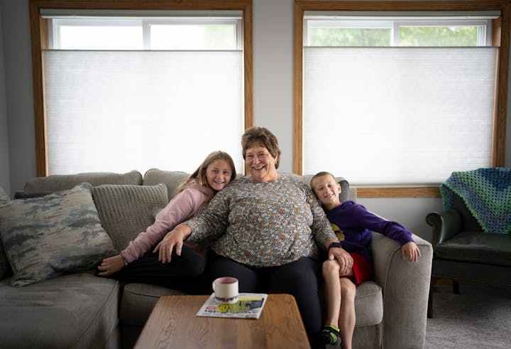 Deb Jerikovsky poses for a picture with her grandchildren Emersyn Alain, 10, and Cameron Alain, 7, at her new home in Coon Rapids. (Renée Jones Schneider/Minneapolis Star Tribune/TNS)