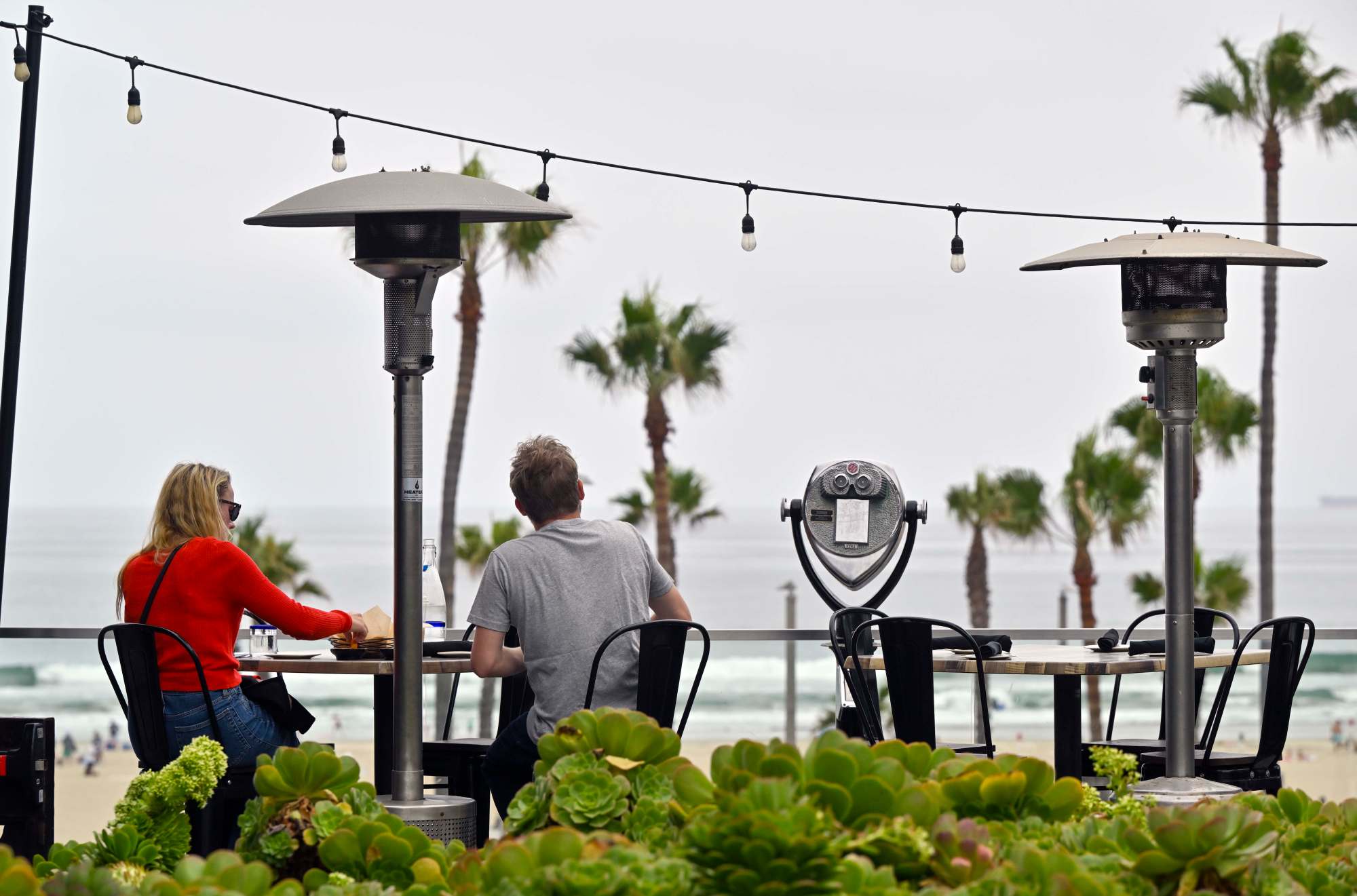 Diners eat on the patio at Ola Mexican Kitchen in Pacific City in CITY HERE, CA, on Wednesday, June 19, 2024. (Photo by Jeff Gritchen, Orange County Register/SCNG)