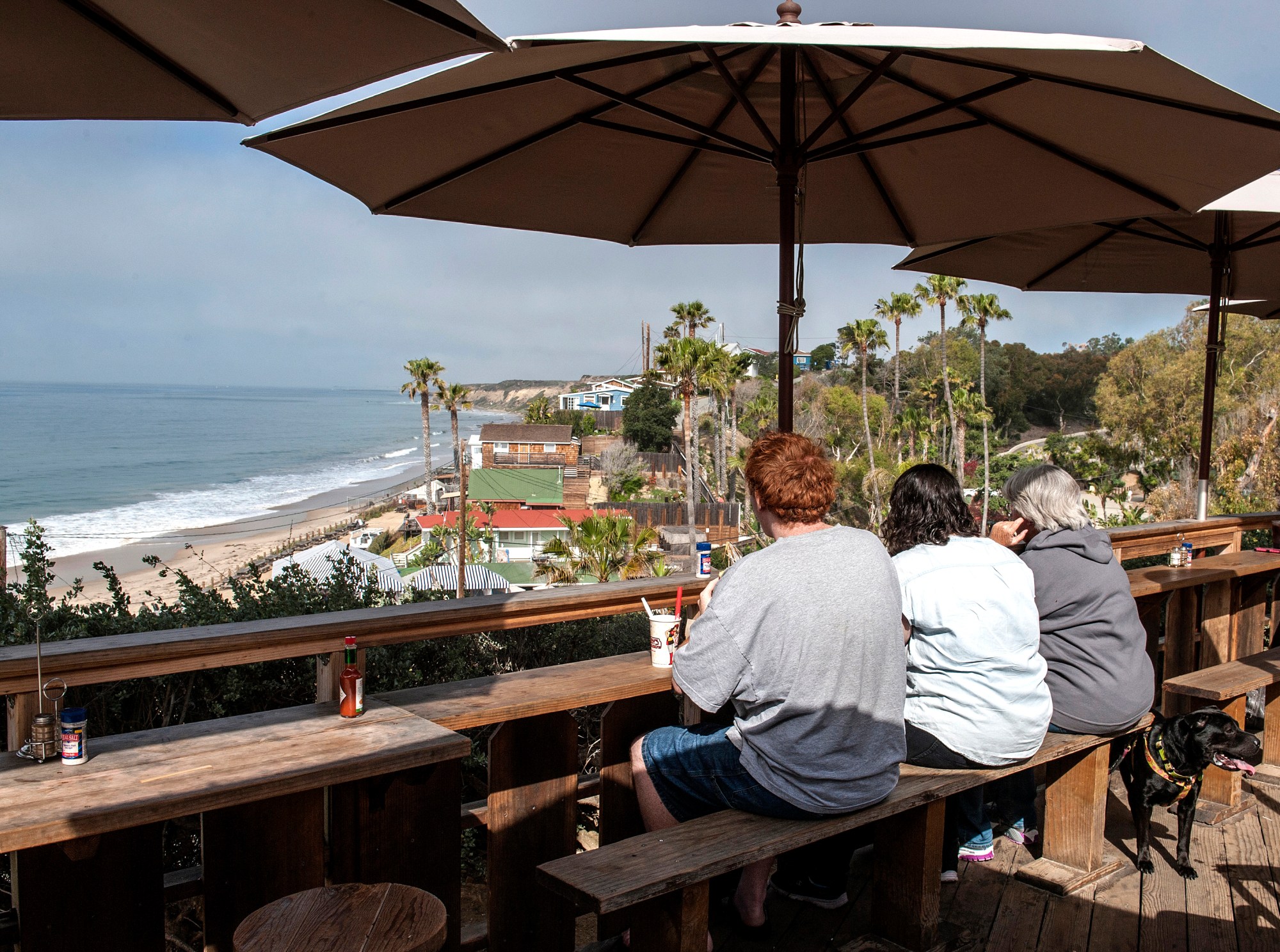 Diners at Ruby's Crystal Cove Shake Shack on Pacific Coast Highway in Newport Beach have a view of the ocean and cottages in Crystal Cove State Park. (Photo by Mark Rightmire, Orange County Register/SCNG)