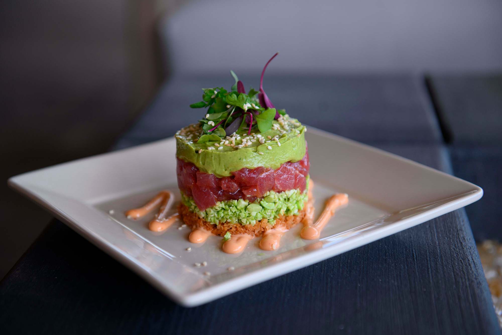 The Ahi Tower appetizer is layered with edamame, avocado, wonton, soy salt, and sambal aioli at Salt Creek Grille in Dana Point on Friday, June 14, 2024. (Photo by Paul Rodriguez, Contributing Photographer)