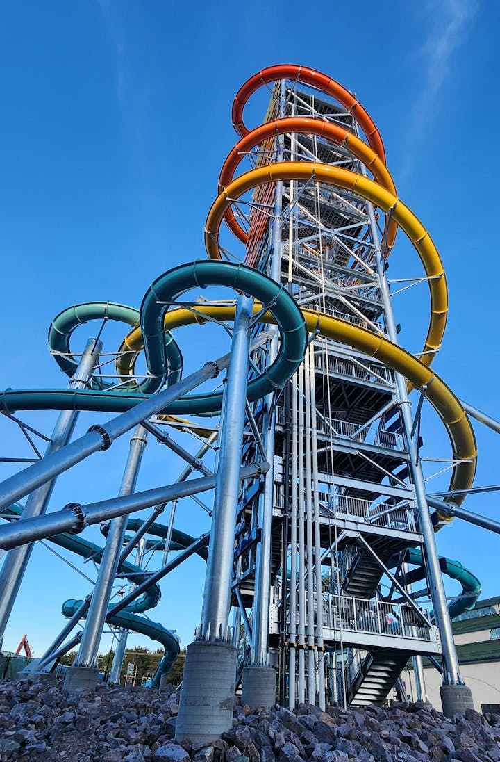 The Rise of Icarus tower features one 145-foot-tall waterslide starting at the top and four 60-foot-tall slides (in blue/green). (Simon Peter Groebner/Mineapolis Star Tribune/TNS)
