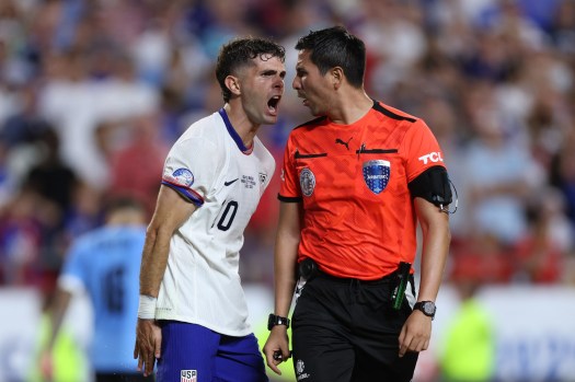 The Americans fail to get out of group play after a 1-0 defeat on a questionable second-half goal by Mathías Olivera, a loss that will increase pressure on U.S. Soccer to remove Coach Gregg Berhalter before the 2026 World Cup.