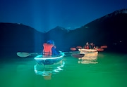 A group paddles Wallowa Lake just after sunset in light-up clear kayaks provided by JO Paddle, an outfitter based in Joseph.