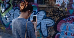 girl looking at smartphone