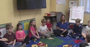 kids sitting on floor meditating