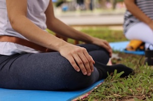 sitting in lotus position