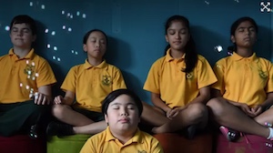 students sitting meditating