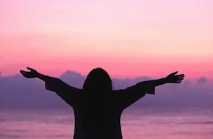 silhouette at sunset by beach