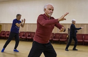 adults doing tai chi