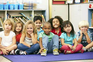 group of children sitting on floor