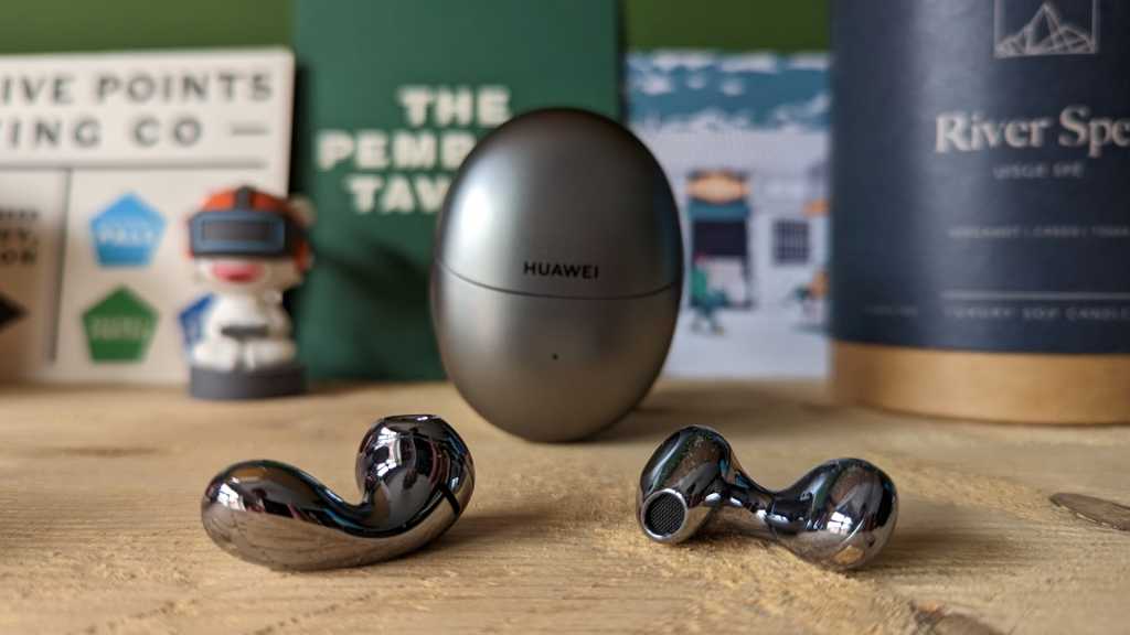 Huawei FreeBuds 5 wireless earbuds with case behind