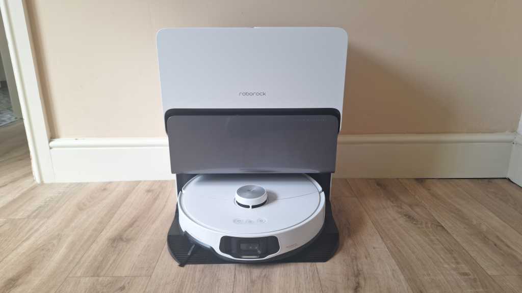 A front view of the Roborock S8 MaxV Ultra robot vac and mop in front of a nutmeg wall with cream skirting