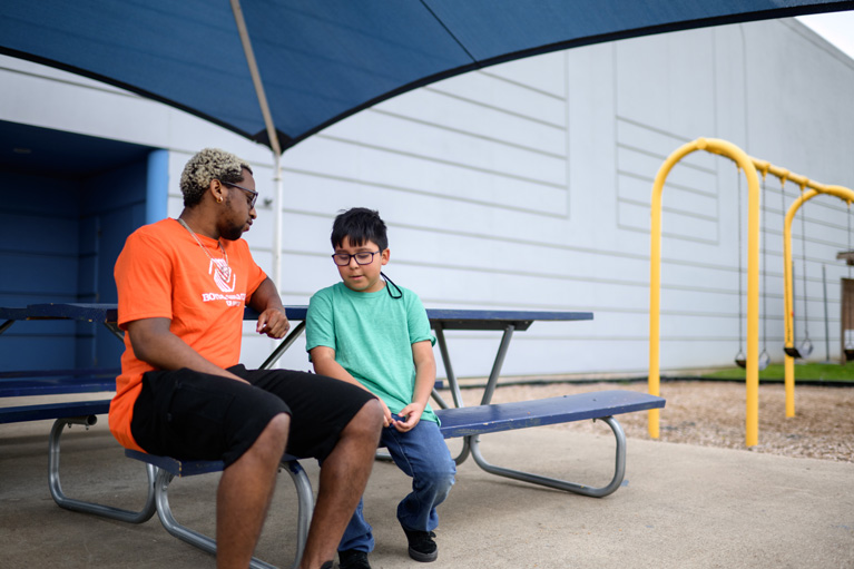 Youth Development Professional talking to a Club kid