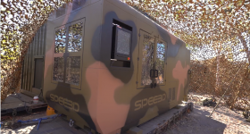 A camo-colored version of SPEE3D's WARPSPEE3D 3D printer.