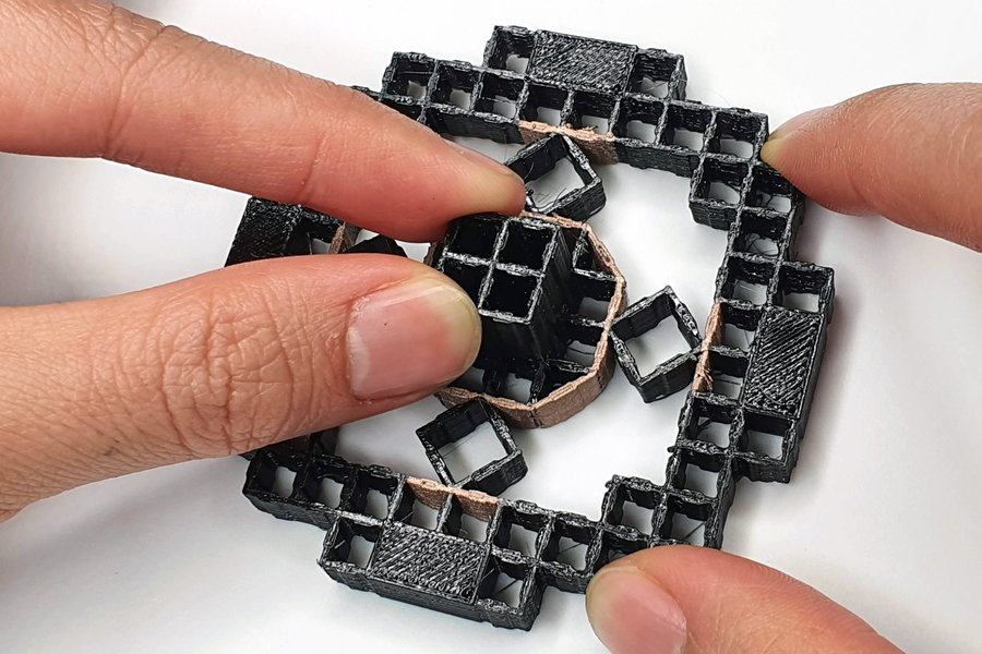 The metamaterial is made up of rows of repeated cells, with conductive walls acting as the electrodes. Photo via MIT.